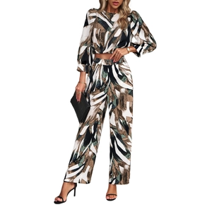 Chic women's tie-dye two-piece set featuring long sleeve crop top and wide-leg trousers