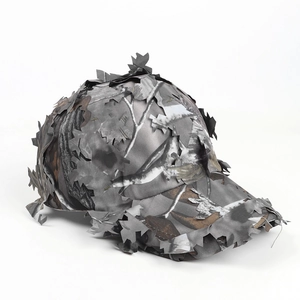 Detail of 3D laser-cut leaves on a woodland camouflage tactical baseball cap