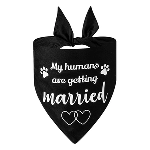 Wedding themed black dog bandana with My humans are getting married print and heart pattern
