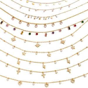 Golden titanium steel necklaces with butterfly and zircon pendants on white background