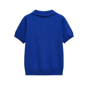Macro detail of the back view of royal blue knit polo shirt with ribbed cuffs
