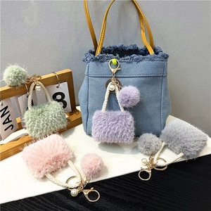 Plush mini bag keychain set with pearls and woven handles in multiple pastel colors