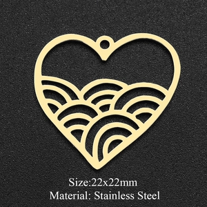 Close-up of golden stainless steel heart pendant with wave pattern and size 22x22mm