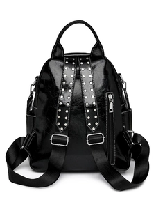 Black glossy patent leather backpack for women with silver studs and adjustable straps