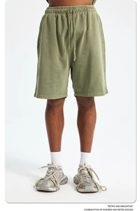 Detailed view of olive green 420g washed cotton men's sports shorts with drawstring waist