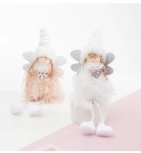 Detail of plush Christmas angel dolls in pink and white with glittering wings and long legs