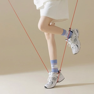 Women's antimicrobial five-finger yoga socks with purple stripes shown in action