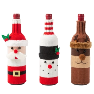 Three-piece knitted Christmas wine bottle covers featuring Santa, snowman, and reindeer