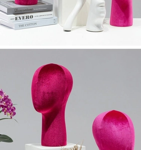 Detail of rose red velvet head mannequin for displaying hats and accessories with soft texture