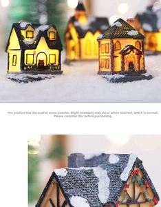 Detail of a glowing Christmas snow house model made of resin with warm LED light