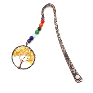 Detail of vintage bronze tree of life bookmark with colorful chakra beads and citrine