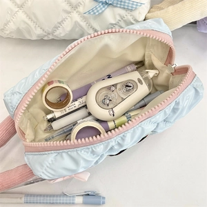 Close-up of quilted puffy pencil case showing large capacity for stationery items