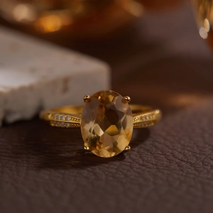 Elegant S925 sterling silver ring with oval yellow citrine and side stone accents