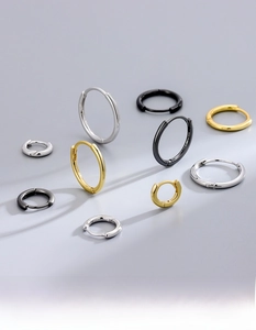 Detailed view of S925 sterling silver hoop earrings in silver, gold, and black finishes