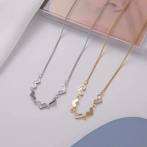 Elegant gold and silver heart-shaped necklaces with mother of pearl shell inlays