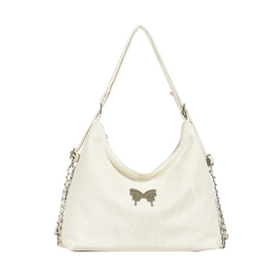 Versatile white shoulder bag with metallic bow detail and elegant chain strap on white background