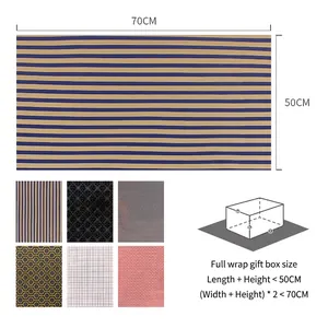 Minimalist black plaid gold-stamped gift wrapping paper with multi-pattern geometric designs