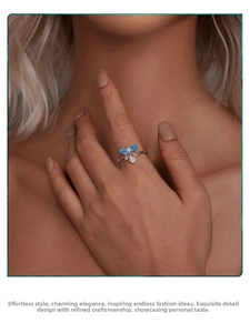 Close-up of S925 silver iris flower ring with blue enamel petals and zircon center