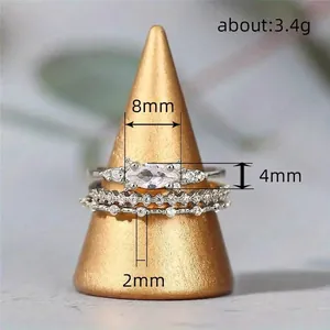 Three-piece set of marquise cut diamond stacking rings in polished silver finish