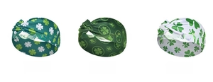 Detailed view of three St. Patrick's Day headbands with green clover patterns and twist knot