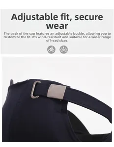 Detail of adjustable metal buckle and dark blue fabric strap on a men's baseball cap