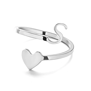 Macro shot of silver adjustable ring featuring a 3D heart and letter S design