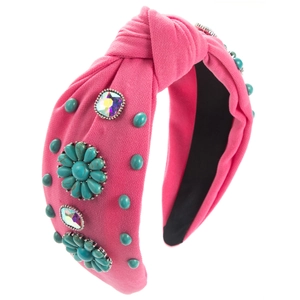 Close-up of knot headband with turquoise beads and crystals on fuchsia knit fabric
