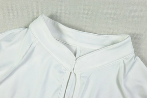 Detailed close-up of white stand-up collar with reinforced double-line stitching on fabric