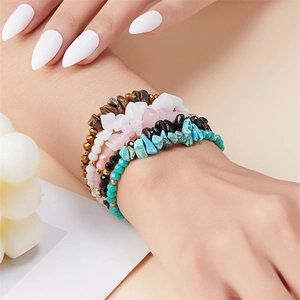 Multilayer natural stone bead bracelet set with tiger eye and quartz on a model wrist