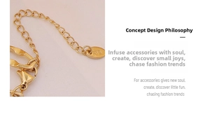 Macro shot of 18K gold plated chain extender with K18 hallmark tag and lobster clasp