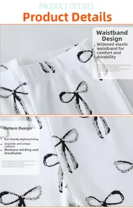 Détail du tissu côtelé blanc avec imprimé nœud noir et taille élastique pour enfant