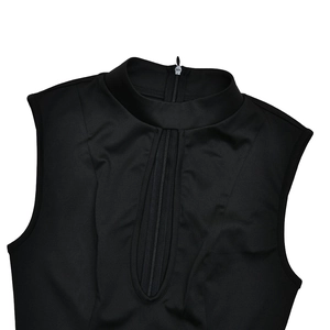 Detail of high collar black sleeveless dress featuring unique front U-shaped zipper design