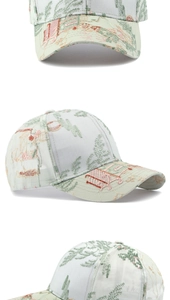 Detail of light green baseball cap with Chinese landscape embroidery and breathable mesh