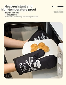 Macro view of thick heat resistant kitchen oven mitt removing hot plate from microwave