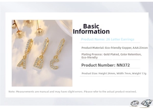 Detail view of gold alphabet earrings with AAA CZ inlay and precise 24x7mm measurements