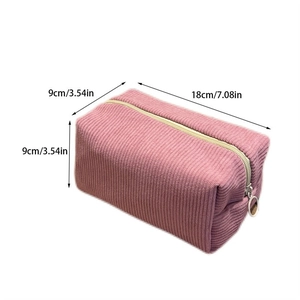 Pink corduroy makeup bag dimensions detail 18x9x9 cm showing size and zipper