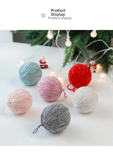 Detailed view of colorful wool felt Christmas balls in festive holiday setting