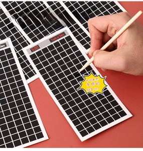 Macro shot of Truth or Dare scratch cards with wooden stylus for interactive party games