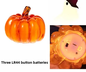 Detail view of Halloween pumpkin LED lamp showing the battery compartment and LR44 power source
