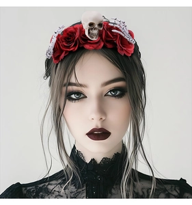 Detail of gothic Halloween headband with red roses, skulls, and skeletal hand claws
