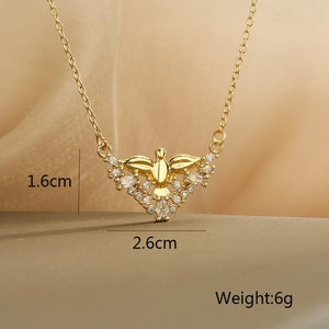 Detailed view of gold plated angel pendant with zircons showing dimensions 1.6cm x 2.6cm