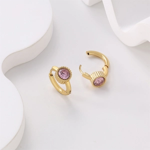 Detail of 18K gold plated stainless steel earring featuring a round pink zircon stone