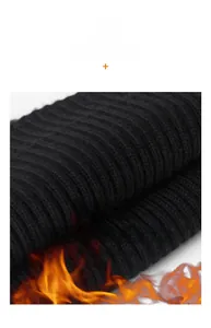 Close-up of black ribbed knit fabric showing thick thermal texture and weaving detail