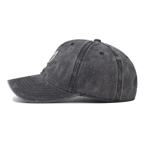 Vintage washed dark grey cotton baseball cap with white heart embroidery on white background
