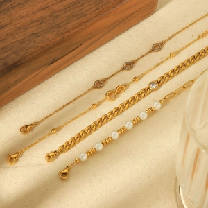 18k gold plated stainless steel bracelet set with pearls, zircon stones and infinity charms