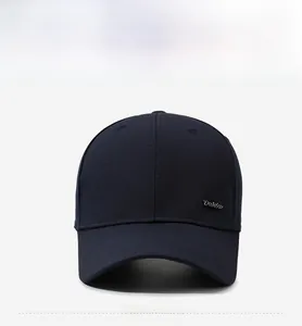 Close-up of side metal logo detail and parallel stitching on navy baseball cap brim
