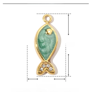 Macro shot of 16mm green enamel fish pendant in stainless steel with crystal detail