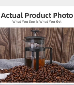 Detail of French press with borosilicate glass and stainless steel filter on coffee beans