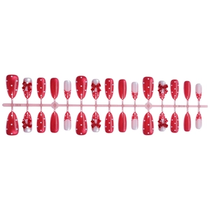 Red almond press-on nails with white polka dots and 3D bow designs in a 24pc set