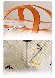 Macro view of reinforced orange handle and durable daisy pattern fabric on storage bag